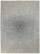 Close-up of Elegance Grey Modern Indoor Area Rug. Mid-century style rug with a starburst pattern in shades of gray and cream.