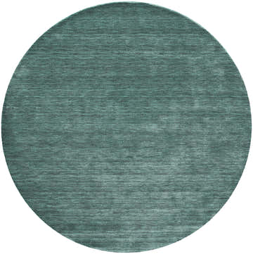 Close-up of a round Feizy Luna Modern Solid Area Rug in green and white, hand woven with a subtle texture. Design-Round
