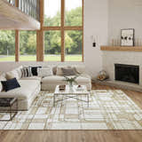 Living room with a Nourison Nordic Ivory Multicolor rug, sofa, fireplace, and large windows.