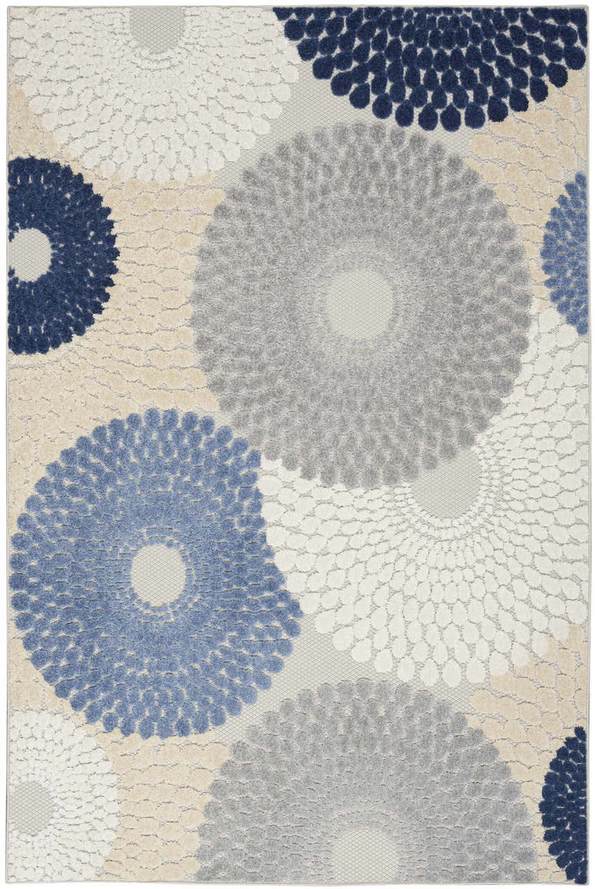 Close-up of the Nourison Aloha Blue Grey Modern Area Rug, featuring a floral-inspired pattern in blue, gray, and beige.