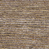 Close-up of the Calvin Klein Mesa Amber Rug showing its nubby texture and horizontal stripes of mustard and beige.