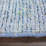 Close-up of the hand-woven Feizy Caldwell rug. Blue and gray wool and viscose fibers create a textured, transitional design. Pile