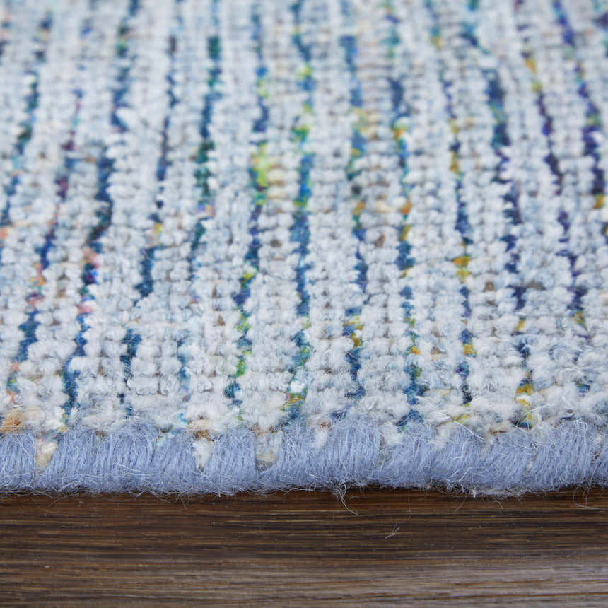 Close-up of the hand-woven Feizy Caldwell rug. Blue and gray wool and viscose fibers create a textured, transitional design. Pile