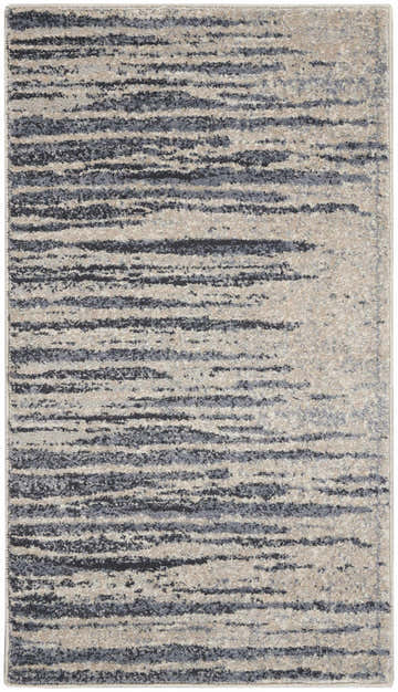 Close-up of Nourison Moroccan Celebration Blue Beige rug featuring a modern, abstract stripe pattern and soft texture.