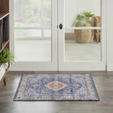 Entryway scene with a Nourison Fulton Blue Vintage Area Rug on wood floors near white french doors.