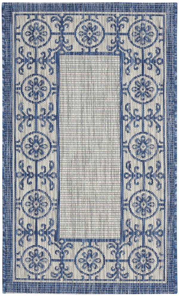 Close-up of Nourison Country Side Ivory Blue Transitional Area Rug with floral medallion border design.