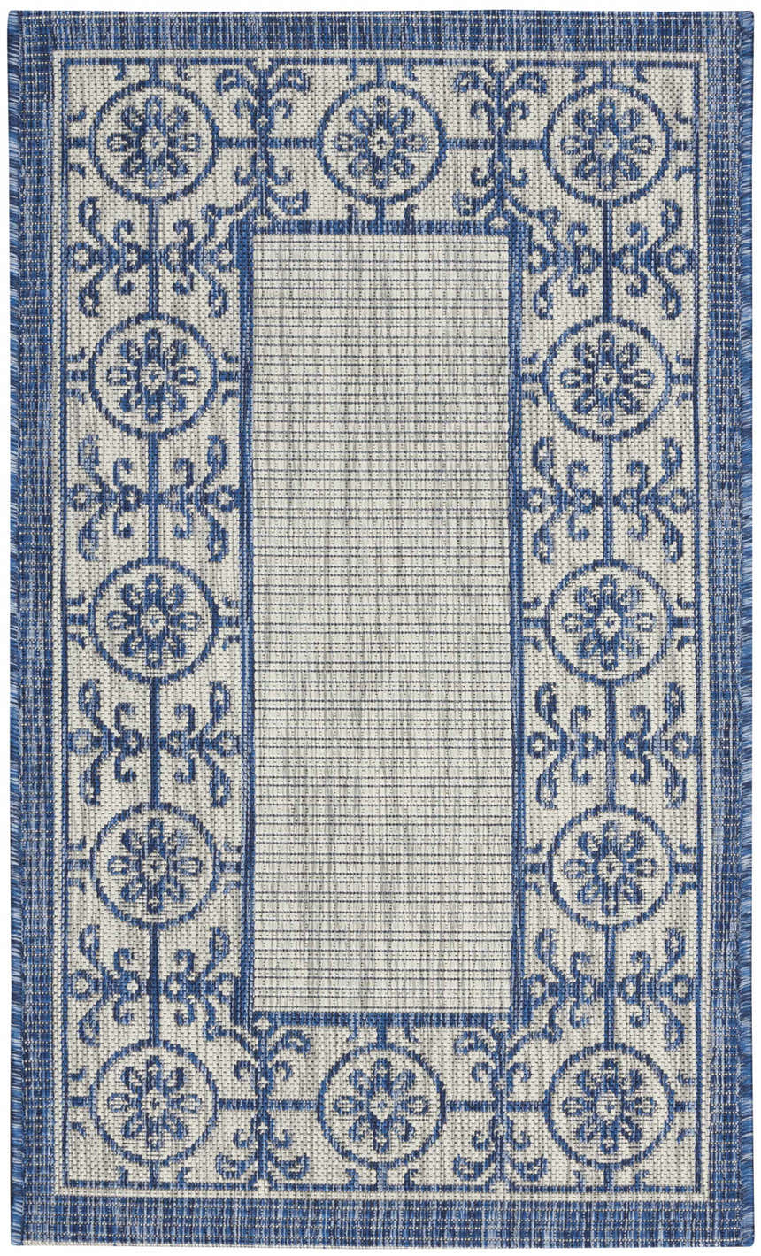 Close-up of Nourison Country Side Ivory Blue Transitional Area Rug with floral medallion border design.