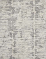 Close-up of the Nourison OCEAN Cream Charcoal rug. Modern design with taupe tones and a subtle linear pattern.