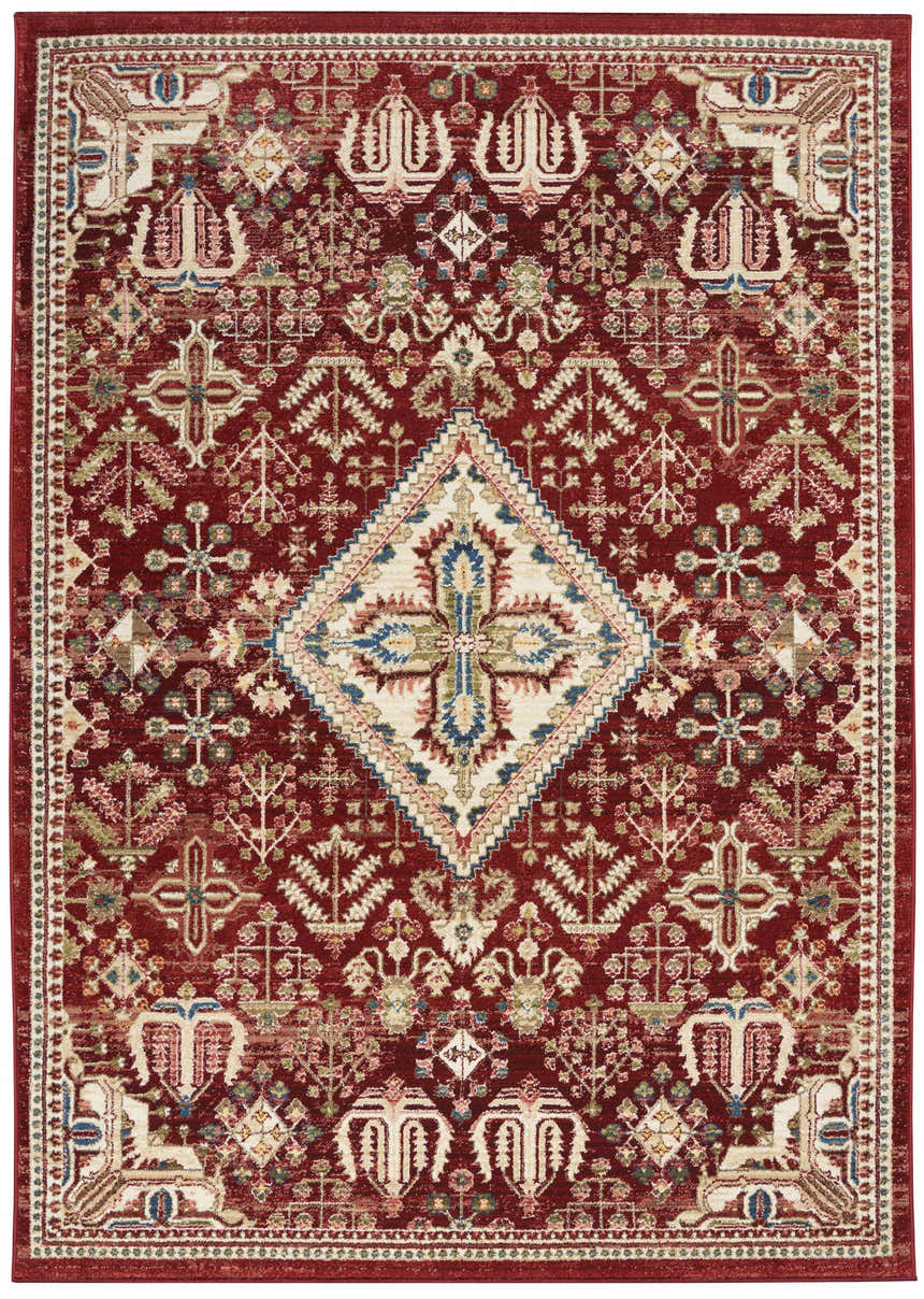 Detailed Nourison Karisma Brick Ivory rug. Farmhouse style with chestnut, ivory, blue, and green tones. Intricate, symmetrical pattern.