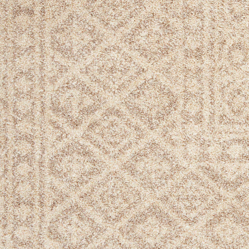 Close-up of the beige Nourison Palermo rug, showing its subtle bohemian pattern and soft, textured weave.