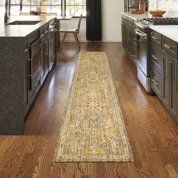 Modern kitchen with dark cabinets and Nourison Antique Bloom Sage runner rug on wood floor.