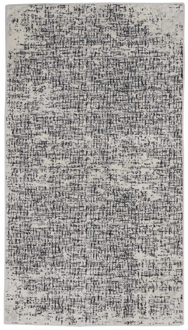 Close-up of Calvin Klein CK970 Vapor rug. Ivory and black modern design with a subtle grid pattern and soft texture.