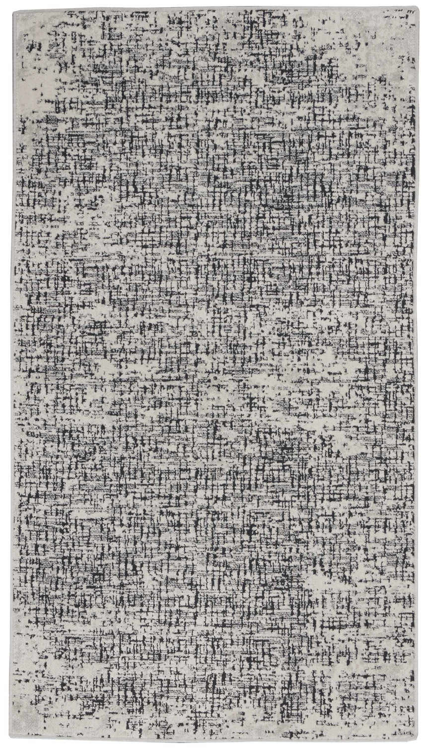 Close-up of Calvin Klein CK970 Vapor rug. Ivory and black modern design with a subtle grid pattern and soft texture.