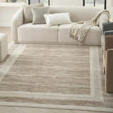 Modern living room with a Nourison Serenity Home Mocha Ivory rug, cream sofa, and neutral accents.