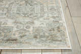 Close-up of Nourison Euphoria Ivory Persian rug showing chestnut, ivory, and gray tones on light wood floors.