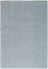 Close-up of Nourison Charm Blue Ivory rug with a modern geometric pattern of rectangles and bars.