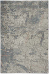 Close-up of Nourison Rustic Textures Light Grey Blue rug with a distressed, modern pattern and subtle texture.