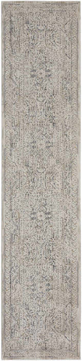 Close-up of the Nourison Lynx Ivory Grey Blue Vintage Indoor Area Rug, featuring a detailed, distressed pattern.