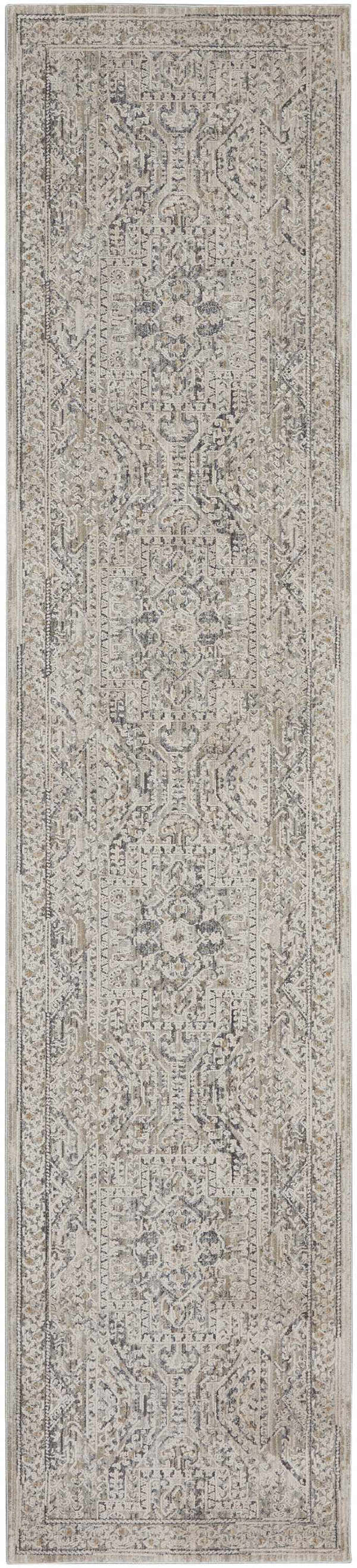 Close-up of the Nourison Lynx Ivory Grey Blue Vintage Indoor Area Rug, featuring a detailed, distressed pattern.