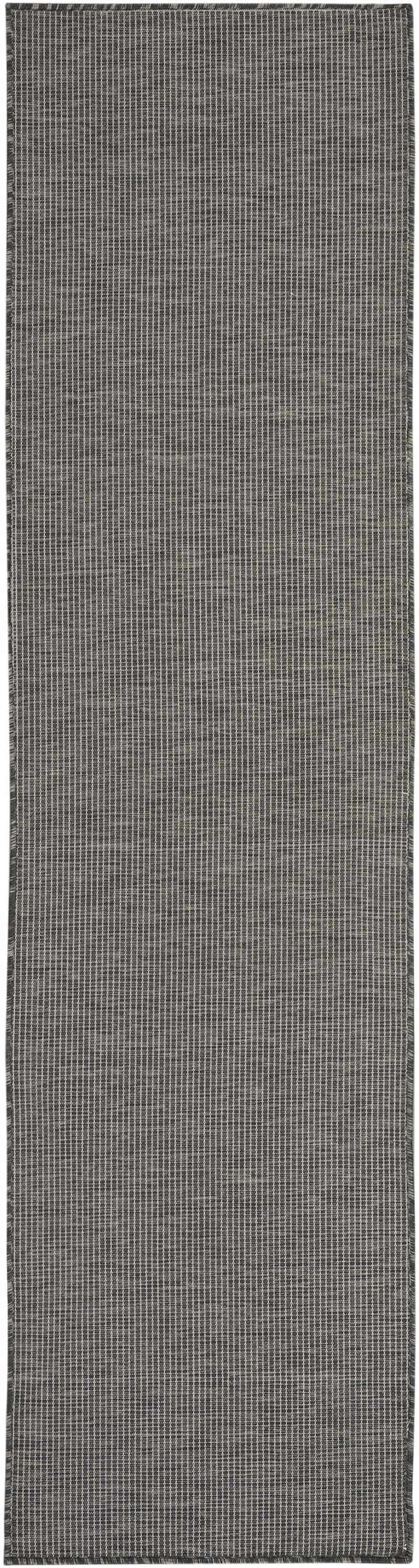 Close-up of the Nourison Positano Charcoal Modern Area Rug showing the taupe color and subtle striped pattern.