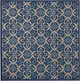 Detailed Nourison Caribbean Navy Contemporary Area Rug with a swirling floral pattern in navy, cream, and light blue.
