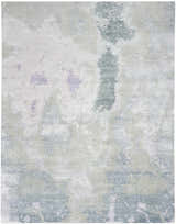 Close-up of Nourison Silk Shadows Blue Green rug. Abstract pattern in shades of blue, green, and gray. Handmade, silk-like texture.