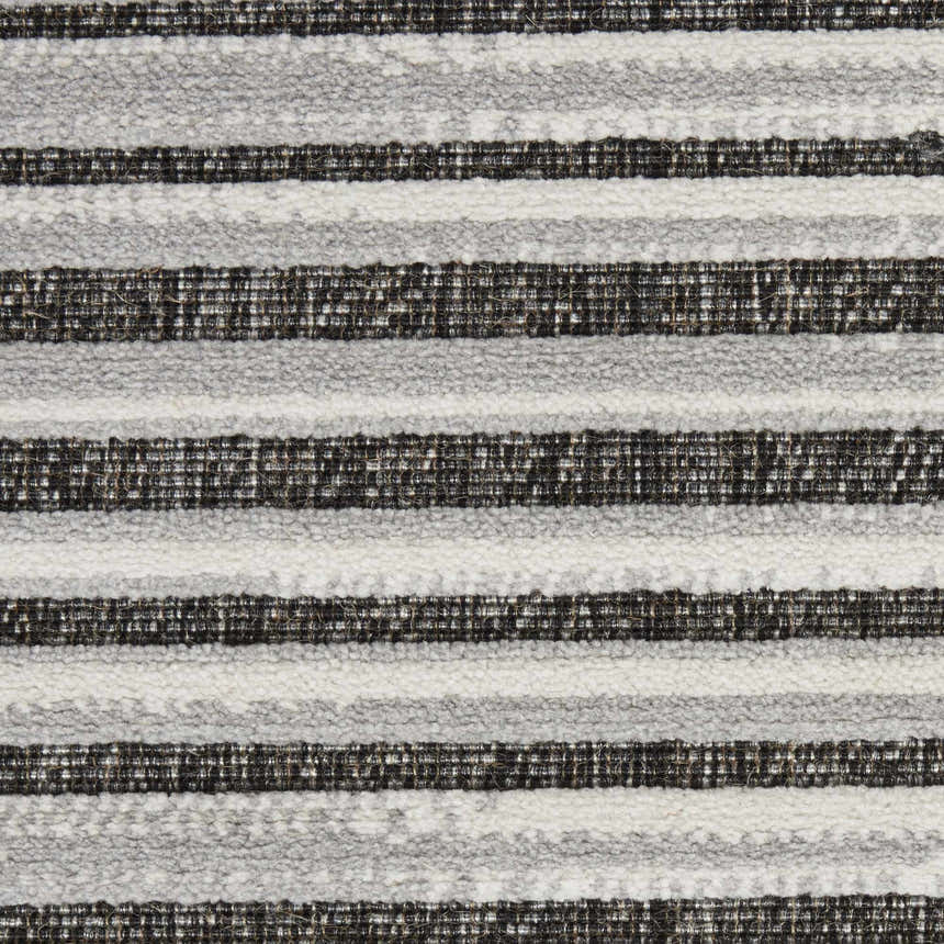 Close-up of the textured Nourison Key Largo Dark Grey rug, featuring a contemporary striped design in gray, white, and black.
