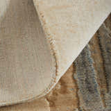 Close-up of the Feizy Jaxson Tan/Brown/Gray Area Rug showing abstract geometric patterns and textures. Fold