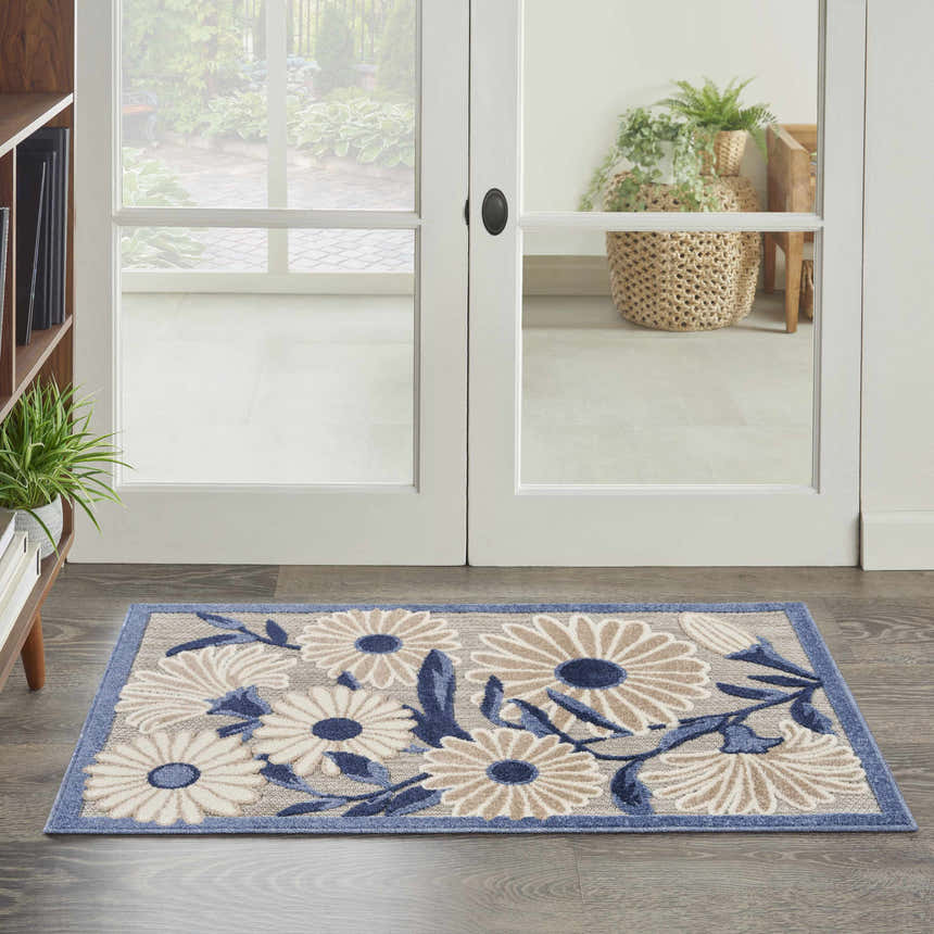Entryway with Nourison Aloha Blue Grey Outdoor Area Rug, featuring a floral pattern and blue border.