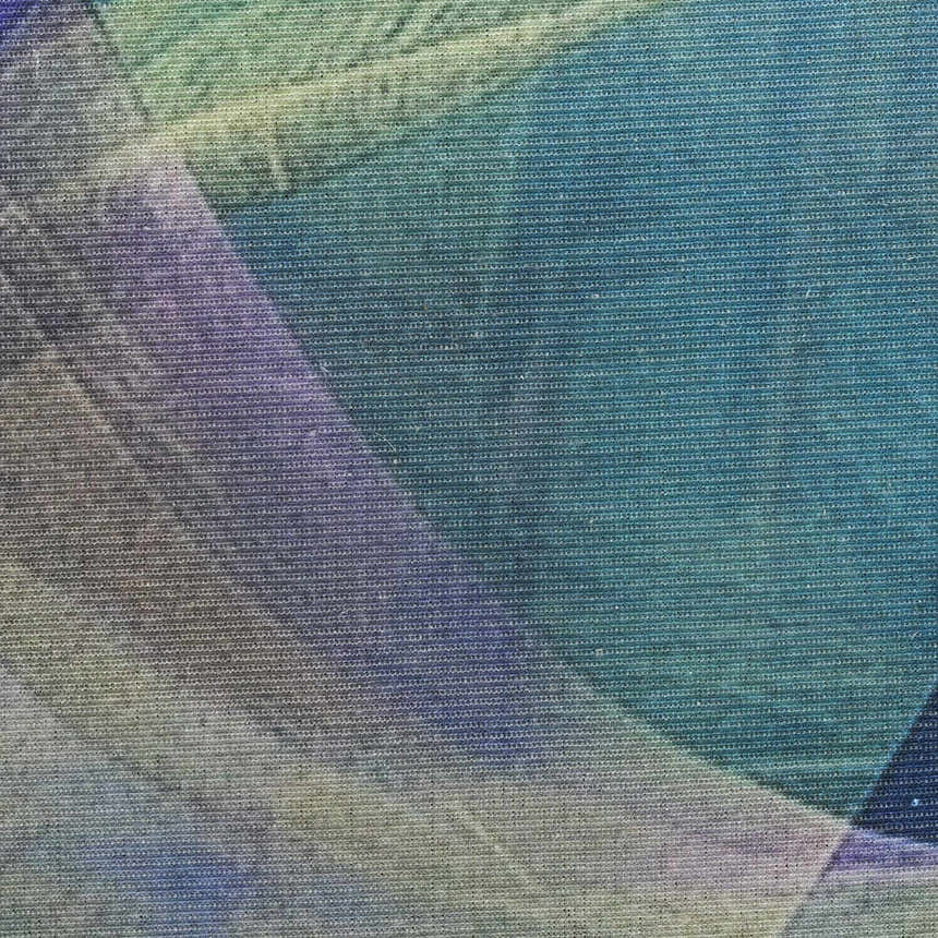 Close-up of the Nourison Blue Multicolor Modern Indoor Washable Area Rug, showing its textured weave and color variations.