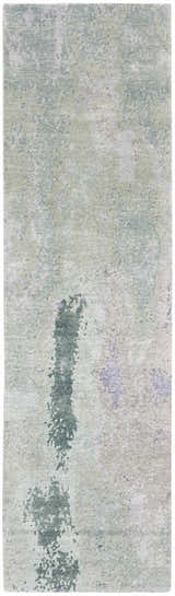 Close-up of the Nourison Silk Shadows Blue Green rug. Abstract pattern in shades of blue, green, and gray. Soft, silk-like texture.