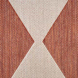 Close-up of the Nourison Positano Terracotta Modern Area Rug featuring a geometric burnt orange and ivory pattern.