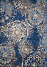 Close-up of the Nourison Somerset Denim rug. Features a circular floral pattern in denim blue and beige.