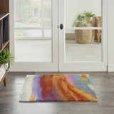 Entryway with Nourison Prismatic Multicolor rug. Modern design in purple, orange, and yellow on wood floor. Bright, inviting space.