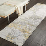 Hallway scene with ivory bench and Nourison Safari Dreams rug in painterly gold and gray.