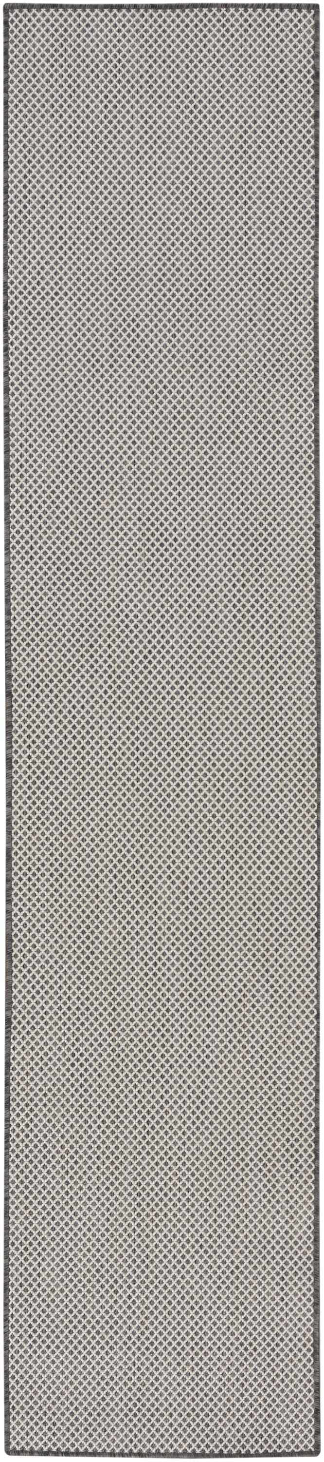 Close-up of the Nourison Courtyard Ivory Charcoal Modern Area Rug, featuring a geometric diamond pattern.