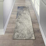 Hallway with a Nourison Passion Charcoal Ivory rug runner on wood floor.
