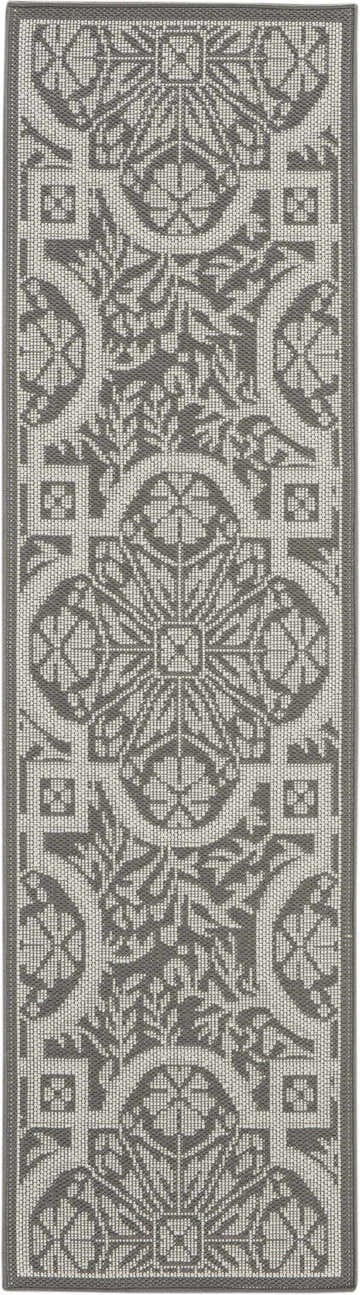 Close-up of Nourison Aruba Ivory/Grey Beach Area Rug featuring a detailed geometric and floral pattern in neutral tones.