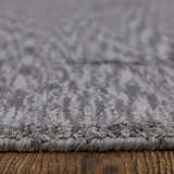 Close-up of the Feizy Marlowe rug in gray and taupe. Hand-woven viscose rug with a subtle chevron pattern. Pile