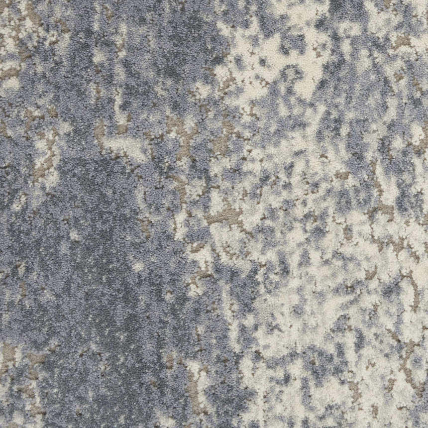 Close-up of the Nourison Sahara Ivory/Slate Rug, showcasing its artistic pattern and texture. Chestnut accents.