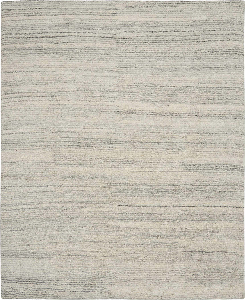 Close-up of the Calvin Klein Agadir Silver Shag Rug, showing its wool texture and subtle gray horizontal lines.