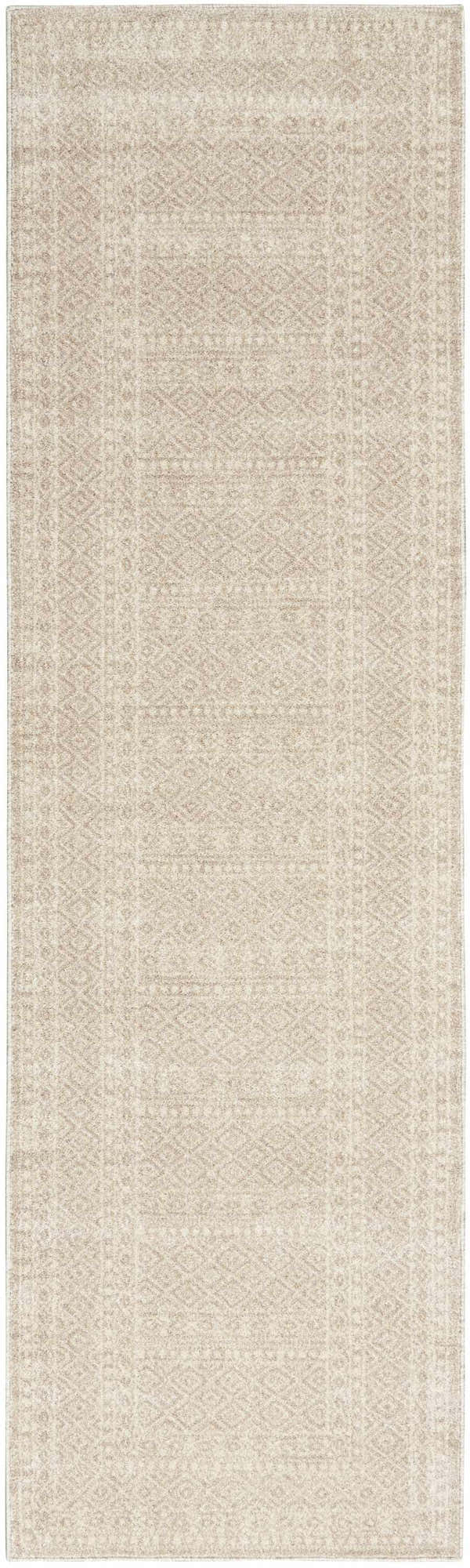 Close-up of a Nourison Palermo Beige Bohemian Area Rug featuring a subtle geometric pattern.