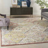 Living room scene with a Nourison Soraya Terracotta Multicolor rug, gray furniture, and a dark wood cabinet.