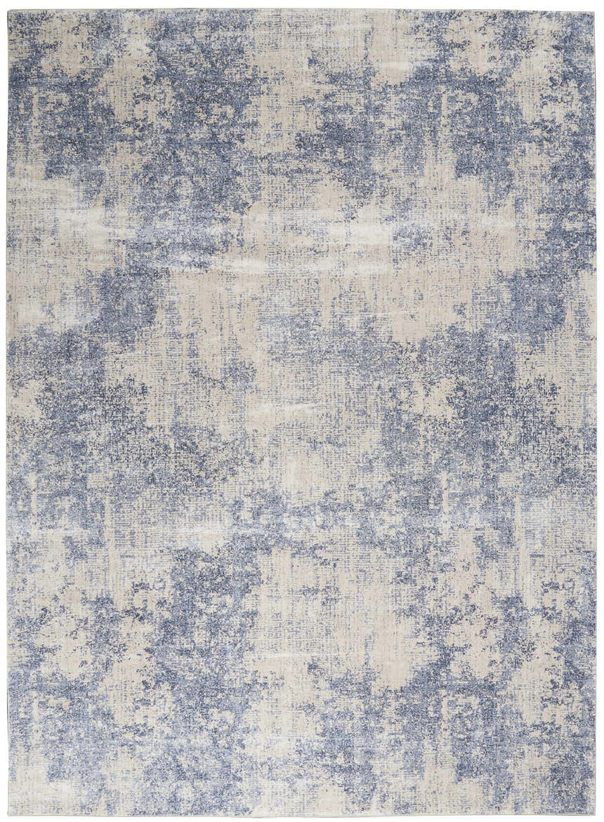 Close-up of the Nourison Silky Textures Ivory/Blue rug. Modern design with chestnut, abstract pattern and soft texture.