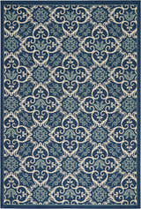 Close-up of the Nourison Caribbean Navy Contemporary Area Rug with a floral and scroll pattern.