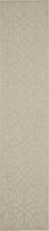 Close-up of the cream Nourison Cozumel Farmhouse area rug, featuring a subtle geometric pattern and textured weave.