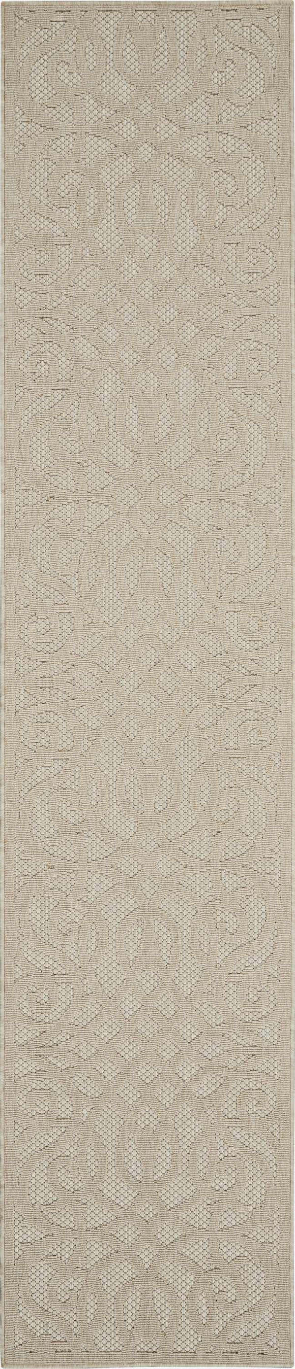 Close-up of the cream Nourison Cozumel Farmhouse area rug, featuring a subtle geometric pattern and textured weave.