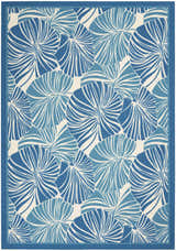 Close-up of the Waverly Sun N' Shade Blue Tropical Area Rug, featuring a light blue palm leaf pattern.
