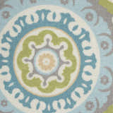 Close-up of Waverly Sun N' Shade Jade rug. Coastal style with a medallion pattern in jade, blue, green, and gray.