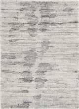 Close-up of the Nourison OCEAN Cream Charcoal rug. Taupe handmade rug with a subtle, modern horizontal pattern.